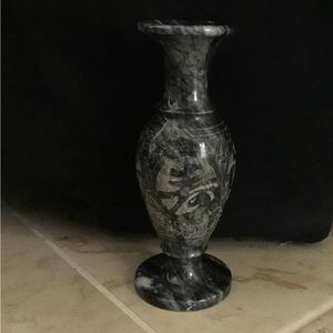 Vase. Black marble with etched design.